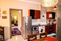 Kuchyň nebo kuchyňský kout v ubytování Desert Pearl Apartment