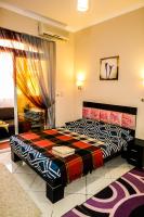 Postel nebo postele na pokoji v ubytování Desert Pearl Apartment