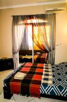 Postel nebo postele na pokoji v ubytování Desert Pearl Apartment