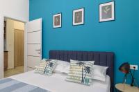 Posteľ alebo postele v izbe v ubytovaní COZY APARTMENT