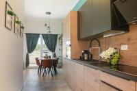 Kuchyňa alebo kuchynka v ubytovaní COZY APARTMENT