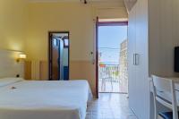 Posteľ alebo postele v izbe v ubytovaní Hotel Riviera