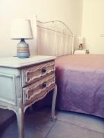 A bed or beds in a room at La Nuova Casetta