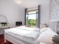 Posteľ alebo postele v izbe v ubytovaní VacationClub – Diune Apartament 60