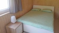 Posteľ alebo postele v izbe v ubytovaní Domki Aqua Holiday
