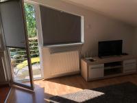 Televízia a/alebo spoločenská miestnosť v ubytovaní Sunrise 3 Apartment