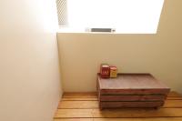 a room with a wooden table and a window at Seville Countrified B&amp;B in Hualien City