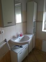 a bathroom with a sink and a mirror at Ferienhof am Nationalpark in Schöneberg