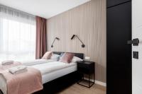Łóżko lub łóżka w pokoju w obiekcie Modern City Center Apartments by Noclegi Renters