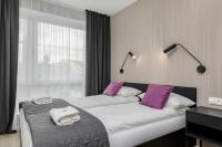 Łóżko lub łóżka w pokoju w obiekcie Modern City Center Apartments by Noclegi Renters