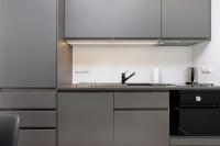Kuchnia lub aneks kuchenny w obiekcie Modern City Center Apartments by Noclegi Renters
