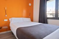 A bed or beds in a room at Habitat Apartments ADN