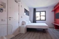 A bed or beds in a room at Habitat Apartments ADN