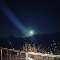 a moonlight on top of a mountain at night at Complejo Pueblo Blanco in Olvera
