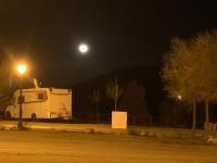 a white truck parked on the side of a street at night at Complejo Pueblo Blanco in Olvera