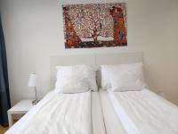 Posteľ alebo postele v izbe v ubytovaní 1210Apartment