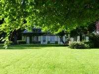 a house with a large lawn in front of it at Orfea s home - maison de charme, Lyons-la-Forêt, accès direct forêt in Le Tronquay
