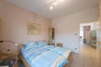 Łóżko lub łóżka w pokoju w obiekcie Appartement Lago Blu