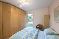 Łóżko lub łóżka w pokoju w obiekcie Appartement Lago Blu