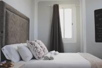 Postel nebo postele na pokoji v ubytování Valencia Apartamentos Goya