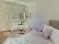 A bed or beds in a room at Blue House Varenna