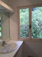 a bathroom with a sink and a window at Villa Bellochio in Menton