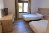 Posteľ alebo postele v izbe v ubytovaní Hostal La Guineu