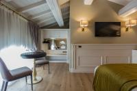 Televízia a/alebo spoločenská miestnosť v ubytovaní Boutique Hotel Villa Zoppi - Adults only