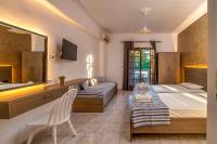 Posteľ alebo postele v izbe v ubytovaní Amarylis Beachfront Studios