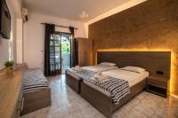 Posteľ alebo postele v izbe v ubytovaní Amarylis Beachfront Studios