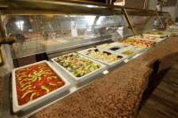 a buffet line with many different types of food at Holiday Inn Queretaro Centro Historico by IHG in Querétaro