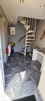 a hallway with a staircase in a house at L orée du Saint-Gangolphe in Lautenbach