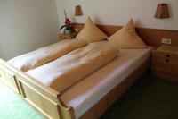 A bed or beds in a room at Haus Praxmarer
