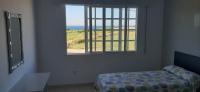 A bed or beds in a room at Dukes Habitaciones
