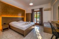Posteľ alebo postele v izbe v ubytovaní Amarylis Beachfront Studios