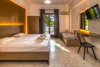 Posteľ alebo postele v izbe v ubytovaní Amarylis Beachfront Studios