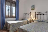Postel nebo postele na pokoji v ubytování Villa Fuentes Sólo Familias