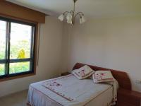 A bed or beds in a room at Apartamento XOSÈ Sanxenxo