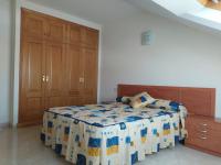 A bed or beds in a room at Apartamento XOSÈ Sanxenxo