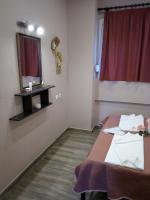 A bed or beds in a room at Athanasia inn II