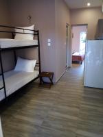 A bed or beds in a room at Athanasia inn II