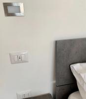 A bed or beds in a room at Torre dei Mori Boutique Rooms B&B