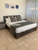 A bed or beds in a room at Torre dei Mori Boutique Rooms B&B