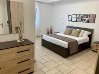 A bed or beds in a room at Torre dei Mori Boutique Rooms B&B