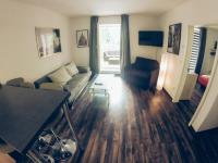 a living room with a couch and a table at Ferienwohnung in Dresden