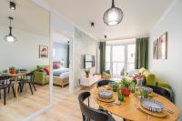 Łóżko lub łóżka w pokoju w obiekcie BellMi Apartamenty - Parking Gratis, Plaża 5min, Komfort i Relaks
