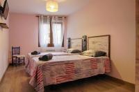 A bed or beds in a room at La Casa de Nini