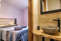 A bed or beds in a room at La Casa de Nini