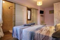 A bed or beds in a room at La Casa de Nini