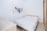 Posteľ alebo postele v izbe v ubytovaní LA SURFERA APARTMENT
